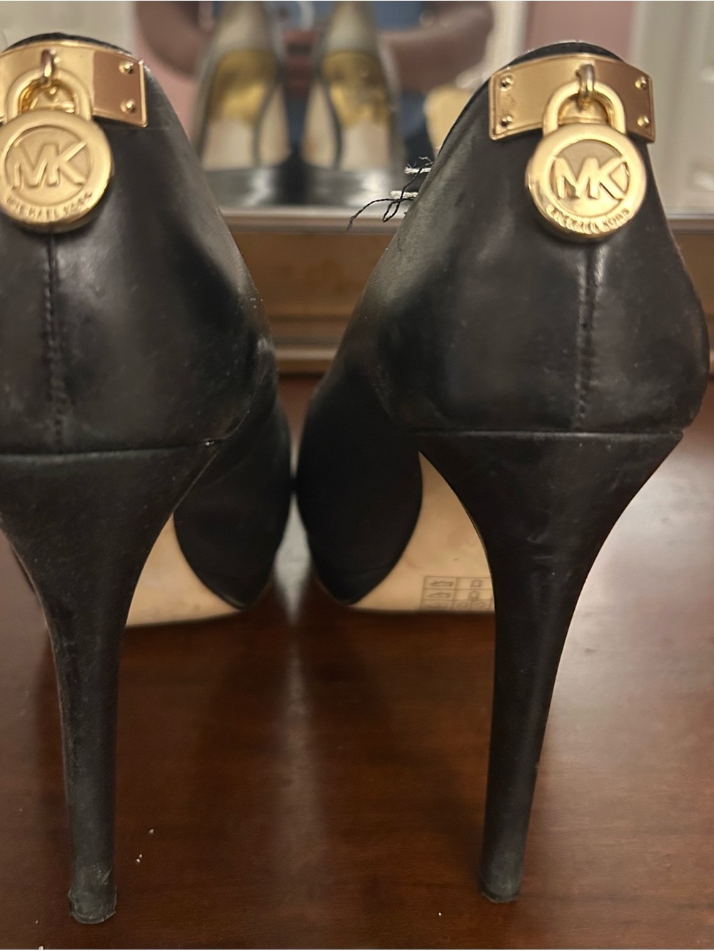 Michael Kors Black Leather High Heel Pumps with Gold MK Medallions